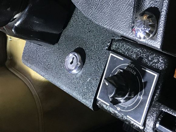 I fashioned this larger ignition switch plate.
