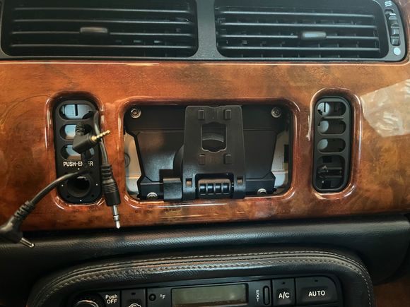 and that's how the wires exit through the fascia. Top hole has the Aux cable wire (dangling), middle has the reverse - camera AV cable, and bottom has the power wire. 