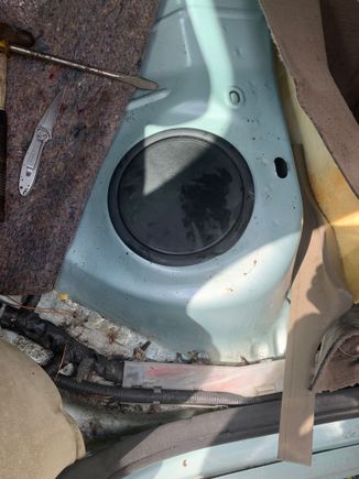 Under this cover is the fuel pump.   A much thicker plastic ring is used making it easy to remove using a screwdriver & a hammer.