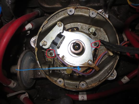 Blue line shows the vac capsule. red rings show the two pozi screws that hold the pickup assmebly to the dizzy chassis.