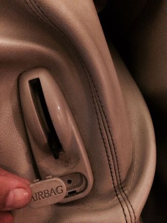 Rear seat access knob removed.