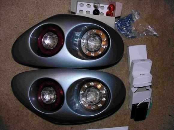 This is the complete kit. The 4 boxes are the load modules.
Write up in the XK8/XKR forum 5-3-09 as "Installed my Adamesh Quad Taillights this weekend."