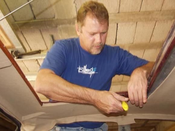 Pulling, stretching and gluing to get a reasonable fit around the sliding roof