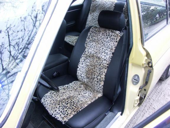 Jaguar front seat - I love how this feels sitting in it - cozy and soft.  The upholstery shop rebuilt up the foam, so instead of feeling like I'm sitting a little in a hole, it's firm and cushioned.  The black is a hide-textured high quality 
imitation leather.