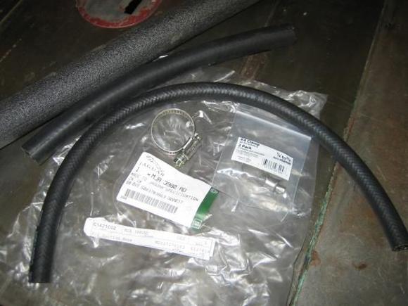 Parts needed: 6 lineal feet of 3/8" low pressure power steering line, 1 lineal foot 5/8" heater hose, 5 lineal feet of 1/2" pipe insulation, 1 each P/S suction hose, 2 each #4 breeze clamps for 3/8" line, 2 each breeze clamps for 5/8" heater hose, 1 quart of dexron III.
