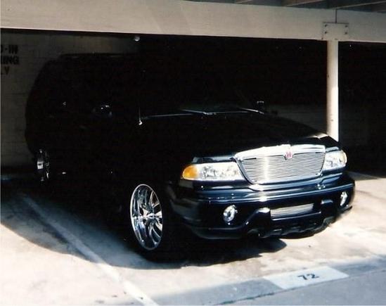 Custom upper and lower grills, monochrome fron and rear bumpers.