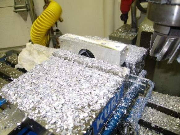 5 9
Here i am milling off as much material as possible to lighten up the bracket and to achieve the overall height required to insure the bracket fit where intended.  Also, note the additional holes - the two inside holes are the clamping bolts and the outer holes are the mounting bolts to mount the bracket to the underside of the dash.