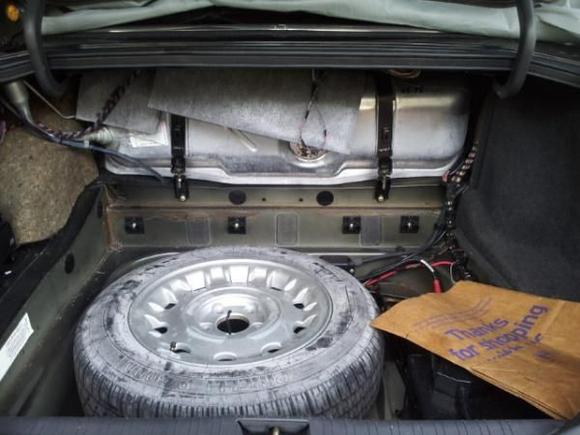 Fuel tank put back in, pulled it out and cleaned old fuel out of it. Checked that the fuel pump still operates before reinstalling the tank. It was not fun to get out and back in.