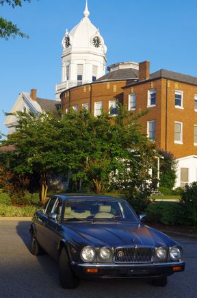 Jag in front of the set for the town play of "To Kill a Mockingbird" -- those are the little fake houses behind and to the right of the car -- in Monroeville, Ala.