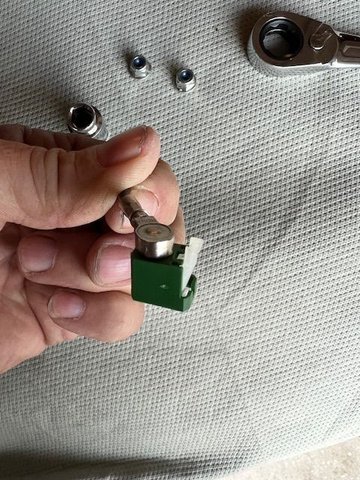 You will have to pull each white tab up in order for the data cable to release and allow its removal from the antenna