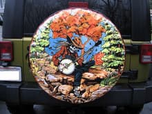 Had this tire cover custom made from my favorite tee...from a set of Dead shows on the fall tour in '93.....Picture is no good....looks GREAT! (P.S. Extra credit if you can find the wolf, an eagle and a &quot;Stealie&quot; in the picture....;-)