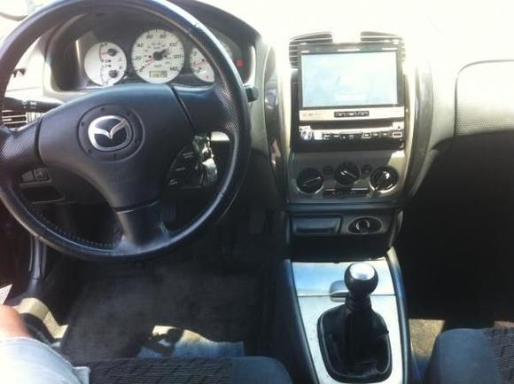 bit of interior! the screen pops up when the car is turned on, got it with the car.