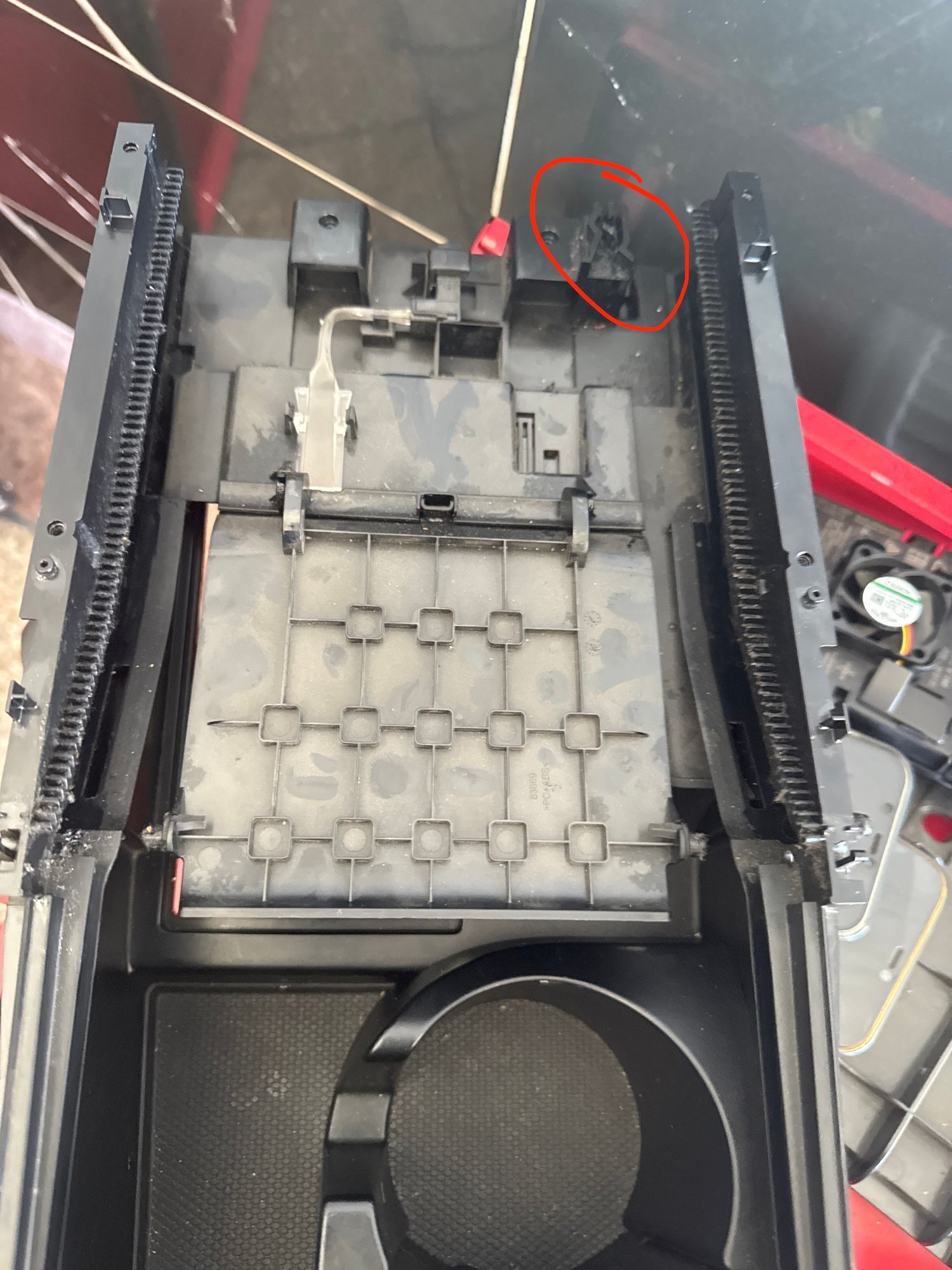Pin goes in and out in this little plastic 'maze'