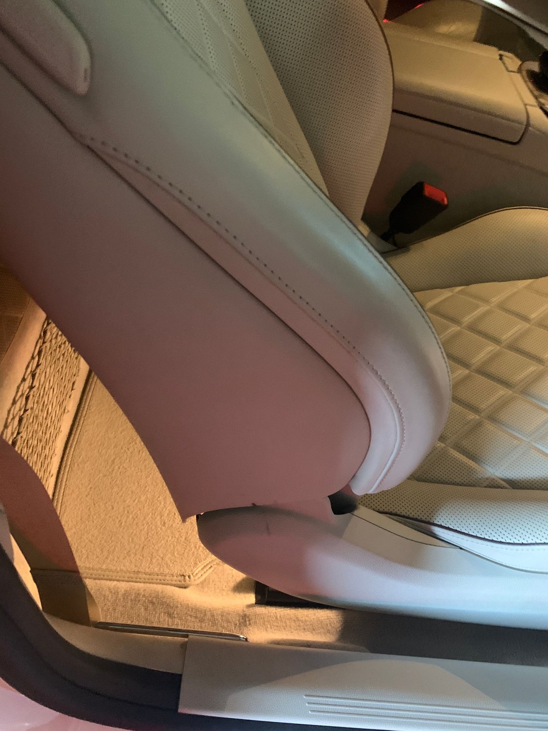 Passenger seat with normal retracted side panel.