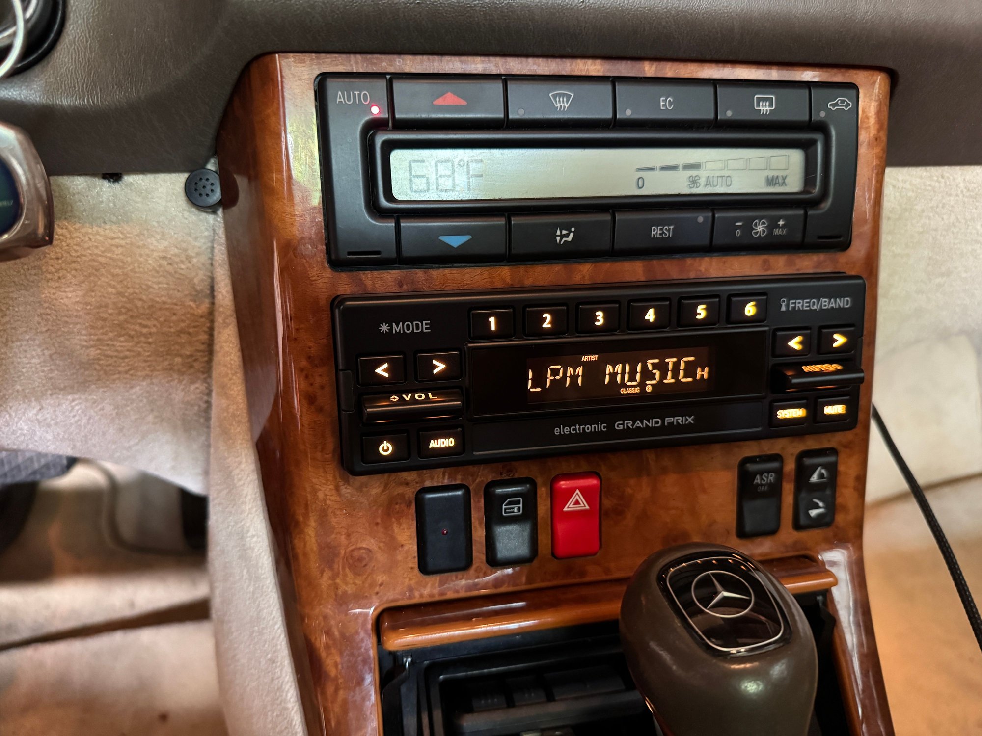 RetroSound Grand Prix 4HD.  I set the button colors to amber.  The same faceplate is installed over several different “motors” (their term) for the actual head unit functions.  You get a USB jack in the back, note my cord running out from the right side of the console.  You also get the proprietary connector for a SiriusXM tuner.  You lose the CD changer connection - that goes unused here.  The 4HD “motor” adds an HD Radio tuner.