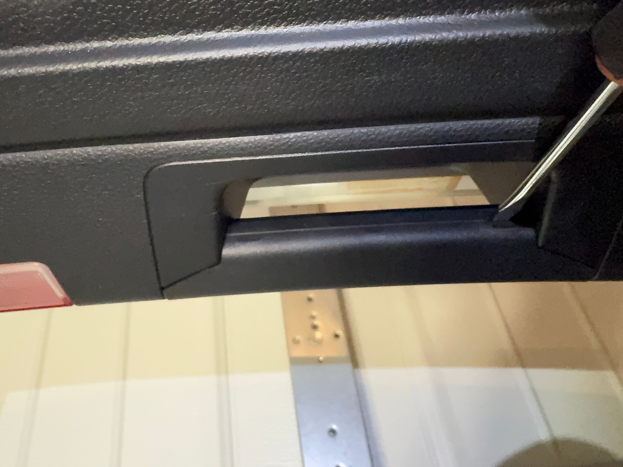 Trunk handles have to be pried off with flathead screwdriver first to access the 2 screws to be removed. 