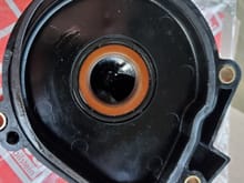 old breather cover.  gasket is flattened.  The round seal actually seemed tight when i fit the old dip pan in it, def was not loose. but theres oil in it so replaced.  I bought the Febi brand from FCP.