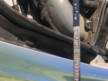 ABC dipstick slightly below bottom level with car raised with button on dash