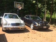 It’s a W208, but definitely kin to my W210. The one one the right is the newest member of the family. She’s a 2000 CLK convertible with....259,000 miles!  Looks, runs and drives great!  AMG wheels, 2-tone grey interior, California car since day one. Was a former Starmark car. Top is inoperable at the moment. Needs a new antenna and a trunk liner, but otherwise, great car!  It’s for one of my daughters. Wish I had something as cool for my first car!  She joins my 2002 E430 and my 1997 W202.  