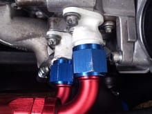 some of the photo is cropped off but there is around 12 mm clearance to the radiator