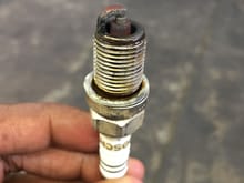 Does this Bosch spark plug looks like it need to be changed on an S500. I am just changing it with a OEM plug cause the engine had rough idle and the air filter.