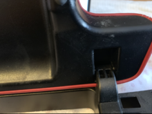 Flap tab towards front on arm rest