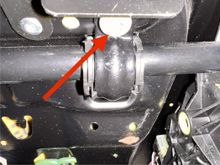 One of the screws. Remove it and it will kisses the c clamp that holds the seat bottom to the frame. 