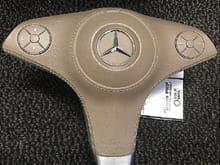 Buttons on the airbag on the 3 spoke steering wheel