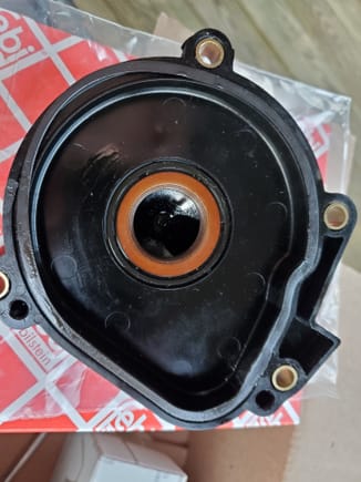 old breather cover.  gasket is flattened.  The round seal actually seemed tight when i fit the old dip pan in it, def was not loose. but theres oil in it so replaced.  I bought the Febi brand from FCP.