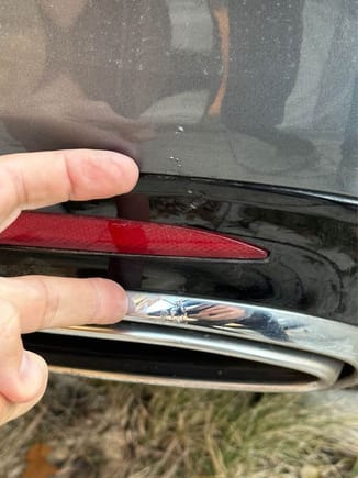 On the backside of the car, there is a mark on top of the exhaust tip that is hardly noticeable, but I like to disclose anything I see because that's what I'd want as a buyer; see two fingers pointing to the marks in pics. 