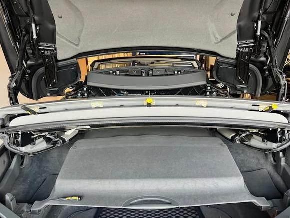 Wedge opening between roof and liner to hold open in place, (I used small screw drivers with rubber handles in former fastener positions).