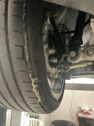 Tire tread wrapped around suspension