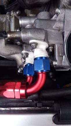 some of the photo is cropped off but there is around 12 mm clearance to the radiator