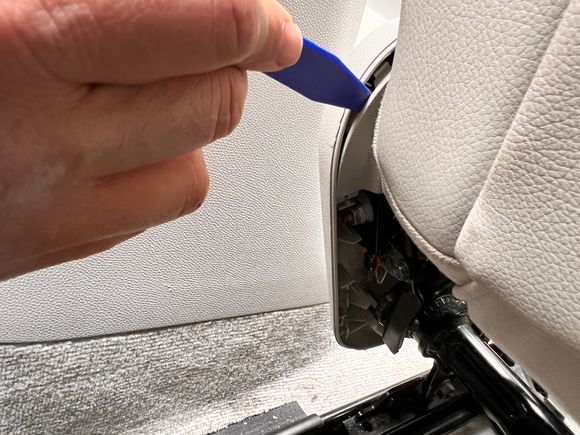 Next, remove this little corner trim piece. I used a plastic trim remover tool cause it was too hard with a finger alone. 