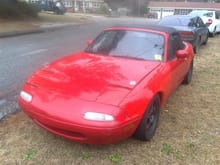 my miata now... after I ghetto rigged it together again and replacing hood, bumper, door, lights, fenders