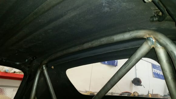 Ultra tall rollbar without paint, being test fit with soft top bar removed.