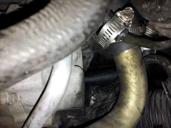 Reuse the hard coolant pipe that goes  to the lower radiator hose.