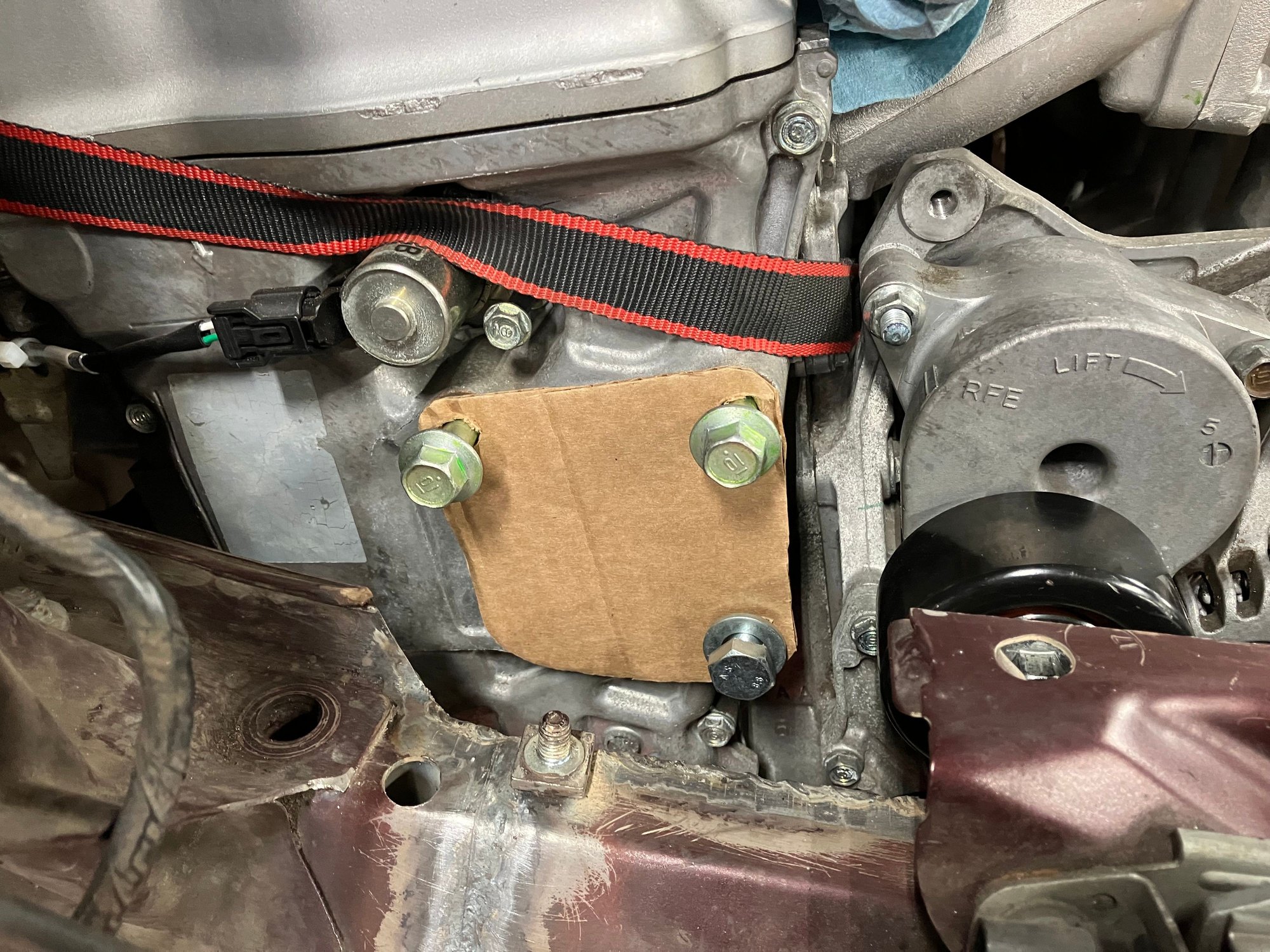 Making the engine mounts was pretty fun to do. I cut out some cardboard and bolted it to the engine to see if everything lined up.