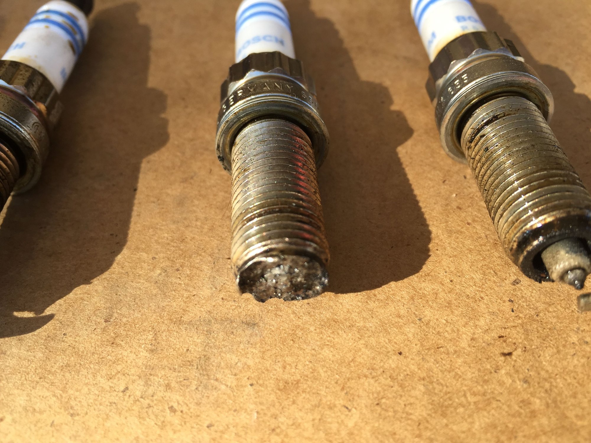 Melted spark plug end North American Motoring