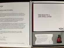 A letter from the Pres of MINI USA, a little book of MINI excitement and a USB drive in the shape of the MINI’s starter button.  I wonder if there is anything preload on it?