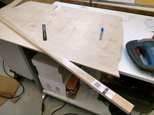 Cut board to length.  Rip it to make rear brace same total height as cargo lid.