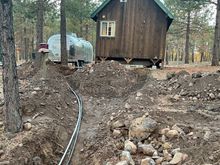 while I have the excavators we dug many extra trenches for more yard hydrants and most exciting, bringing water and fiber optic to the cabin that is 630 ft away; I also prep it for a add on bath with running toilet and shower