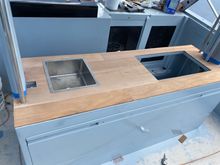 Grill and sink area under the captains bench. 