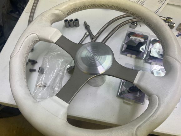 Steering wheel center cap. It will be powder coated, with a PQ logo laser engraved on it.