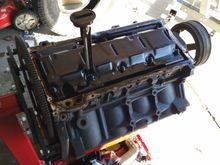 Pan off, there was only 1 bolt holding the oil pickup tube to the mounting surface,  is this normal?