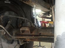 Old block out, getting ready to install add a leaf....had to run a drill bit through the entire leaf pack to get the new pin through it!!