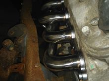 Lots of clearance on the headers, just had to trim off a tab on the transmission , to make it work