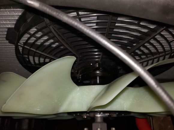 16" Flexalite 3,000 cfm puller installed behind the radiator with custom mounting brackets.