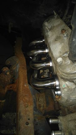 Lots of clearance on the headers, just had to trim off a tab on the transmission , to make it work
