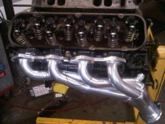 Rocker fits under stock valve cover polys dont yet..lol